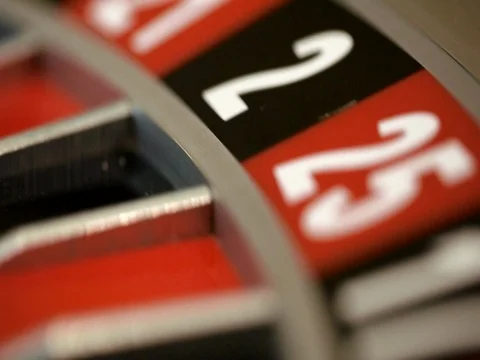 Roulette wheel running and stops with white ball on 22 close-up Stock Footage 74226150