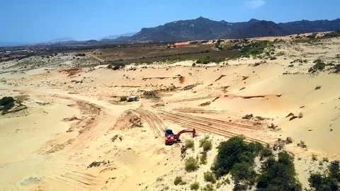 Round aerial view sand pit with truck excavator against hill Stock Footage 104170811