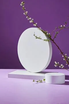 Round and rectangle podium or pedestal in white color decorated with white fl Stock Photos