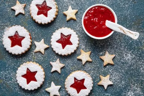 Round and star-like biscuits ginger cookies with strawberry jam. Flat lay Stock Photos