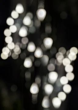 Round and triangular bokeh on a black background. Abstract background with bo 写真素材