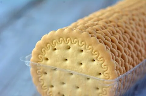 Round biscuits in plastic container Stock Photos