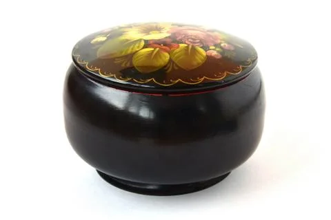 Round black casket with a pattern of flowers on a white background Stock Photos