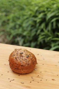 Round, black, grain bread. Stock Photos