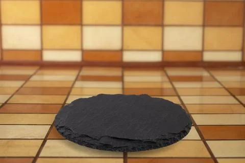 Round black stone slab on Rectangular ceramic tiles counter and backsplash .. Stockfoto's