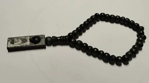 The round black tasbih is very unique Stock Footage 224788231