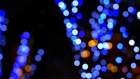 Round bokeh abstract circles blue neon illuminated decoration lights on tree Stock Footage 107943286