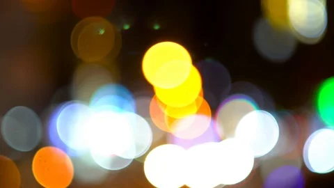Round bokeh and multicolored highlights. Night city in defocus. 스톡 동영상 110636434