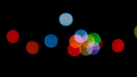 Round bokeh lights on a black background Stock Footage 119386310