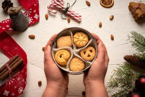 Round box with delicious biscuits above christmas table Stock Photos