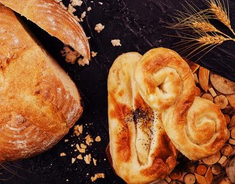 Round bread with buns on top view Stock Photos