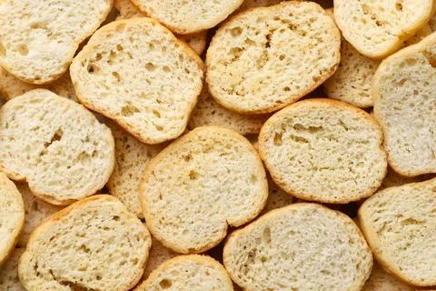 Round bread croutons background. Top view Stock Photos