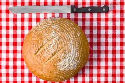 Round bread on kitchen table Stock Photos