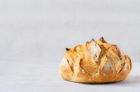 Round Bread Loaf isolated on grey background. Copy space. Stock Photos