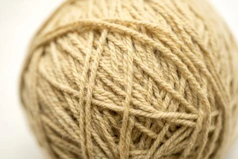 Round brown ball of tangled string object, cat toy, detail, extreme closeup.. Stock Photos