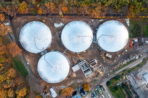 Round buildings of a spherical shape from a height. Modern industrial wastewa Stock Photos