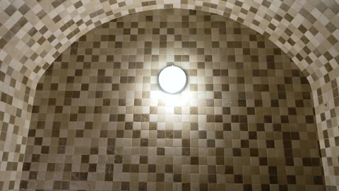 Round ceiling light illuminating mosaic tiles. Video stock 287619710