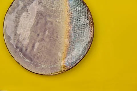 Round ceramic plate on an empty background horizontally Stock Photos