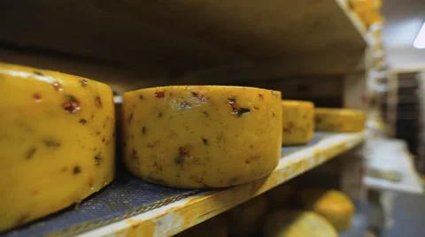 Round cheese in warehouse Stock Footage 68940077