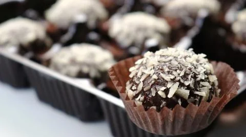 Round chocolate candy in set foreground Stock Photos