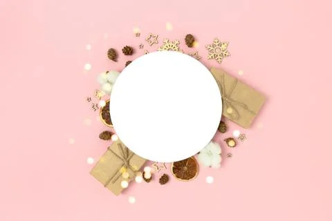 Round clean mockup with frame made of Christmas decoration and gift boxes. Stock Photos