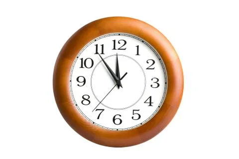 Round clock showing time about twelve isolated Stock Photos