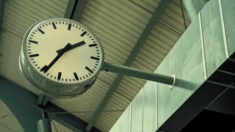 Round clock at a train station showing the time 動画素材 278315991