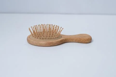 This round comb with a handle is a comb usually used by women. Stock Photos