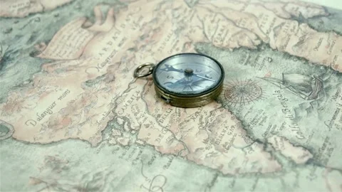 Round compass on background of old map o... | Stock Video | Pond5