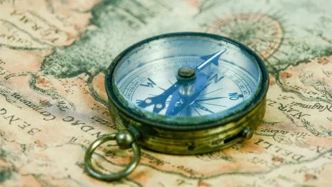 A round compass with its pointer moving 写真素材