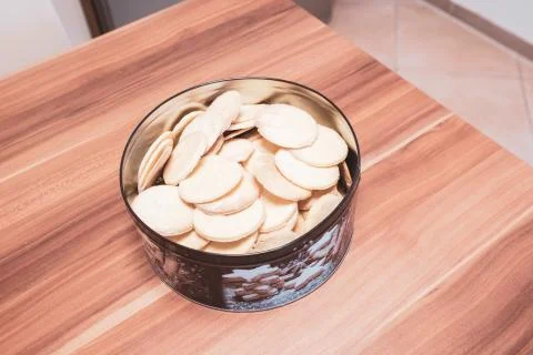 In round cookie tin are the ready-baked Christmas cookies Stock Photos