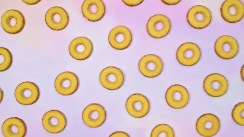 Round cookies biscuit pattern blinking cookies on purple theme. Stop motion Stock Footage 169302349