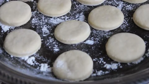 Round cutted dough ready for star cooking bites Stock Footage 162970889