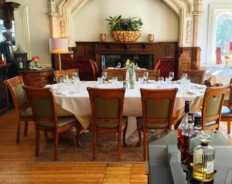 Round Dining Table in Fireplace Room – Berwick Lodge, Bristol Stock Photos