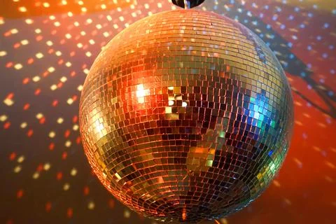 Round disco ball, light reflections on a ceiling Stock Photos