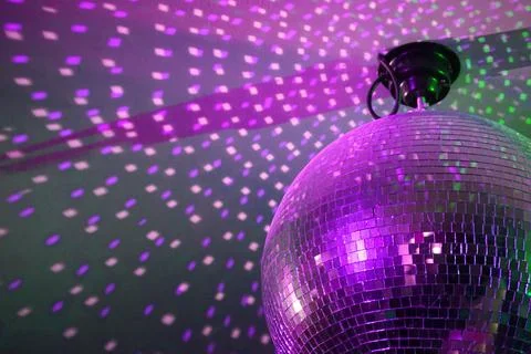 Round disco ball, light reflections on a ceiling Stock Photos