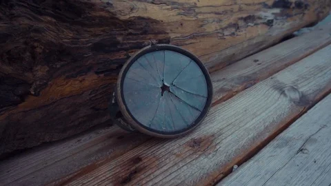 The round diving mask is broken on a dry log Stock Footage 102560734