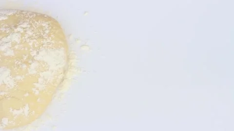 Round dough sprinkled with flour on white background top view. Stock Footage 122305662