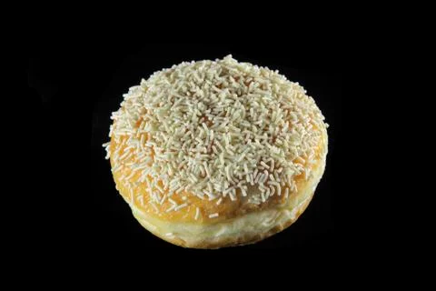 Round doughnut with nuts on black background 02 Stock Photos