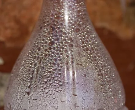 Round drops on a bottle Stock Photos