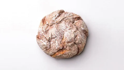 Round embossed bread. View from above. Heartbeat. Stock Footage 98147036