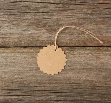 Round empty brown paper tag tied with white string Stock Photos