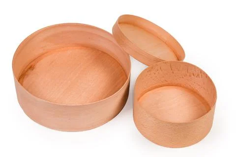 Round empty wooden boxes with open lid on white background Фото