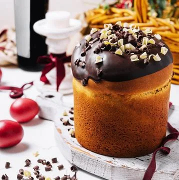 Round fragrant Easter bun with chocolate sprinkles Stock Photos