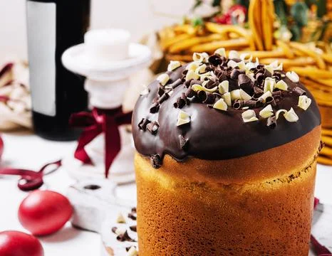 Round fragrant Easter bun with chocolate sprinkles Stock Photos