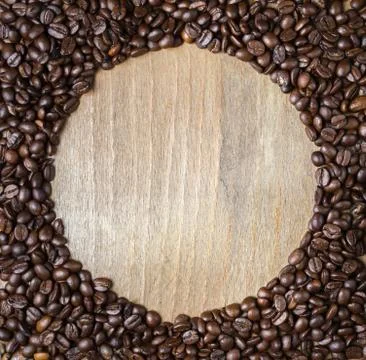 Round frame from coffee beans Stock Photos