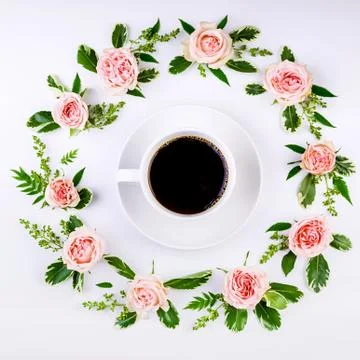 Round frame flower pattern of rosebuds on a white background and a white cup  Stock Photos