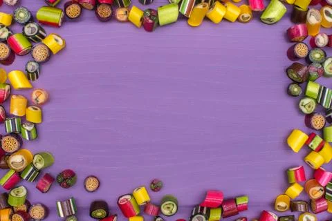 A round frame made of colored caramel candies Stock Photos