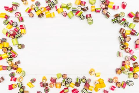 A round frame made of colored caramel candies Stock Photos