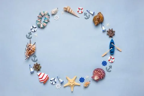 Round frame made of decorative items and miniature toys: seashells, seastars, Stock Photos